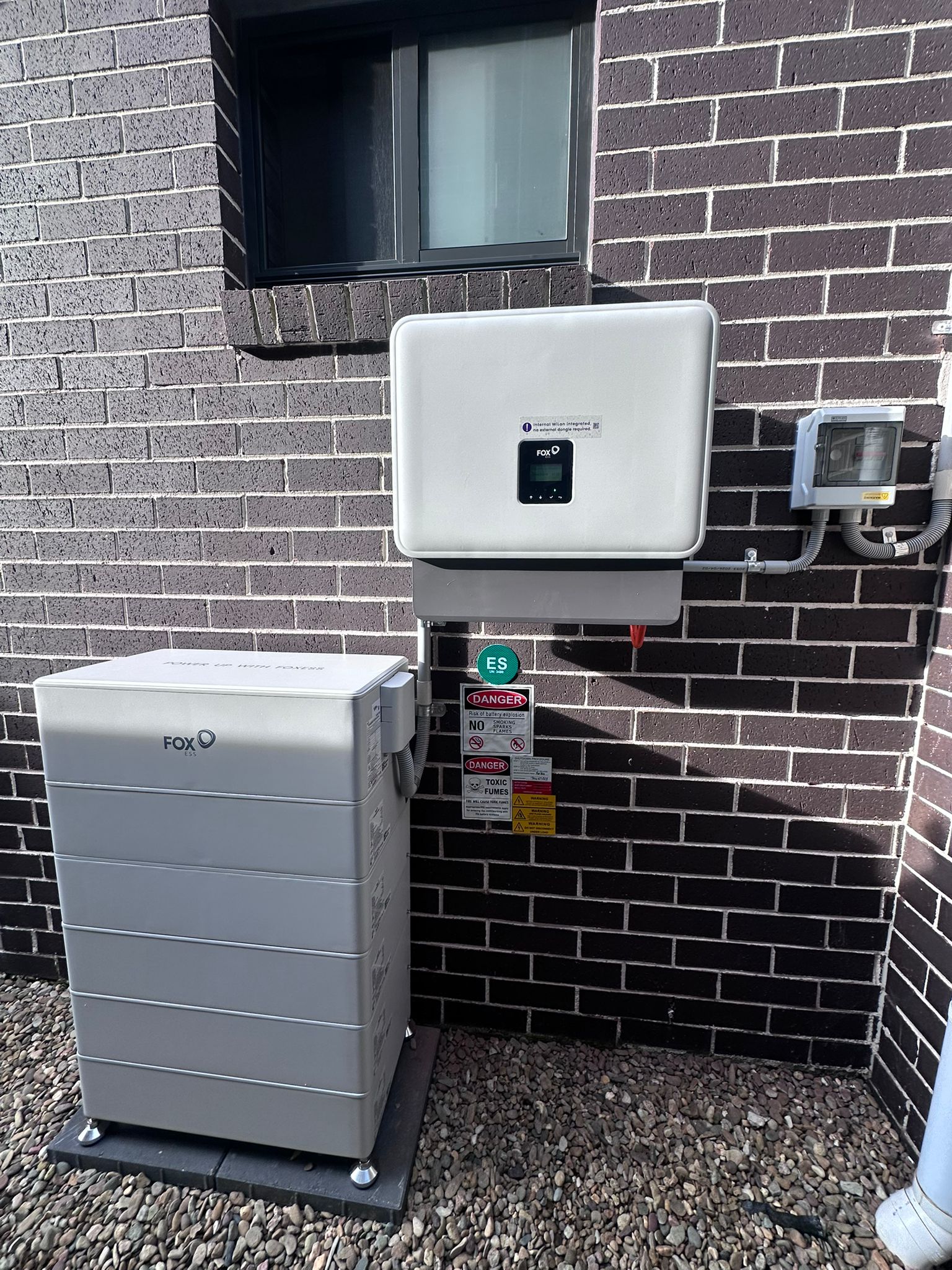 Fox inverter and battery installed outside a Rescom customer's home